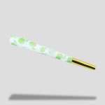 Gold-tipped mouthpiece of HONEYPUFF tropical fruit pre-rolled cones
