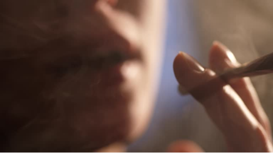 fter picking the best single-person rolling papers, a hand carefully rolls a neat joint for a relaxing solo moment.