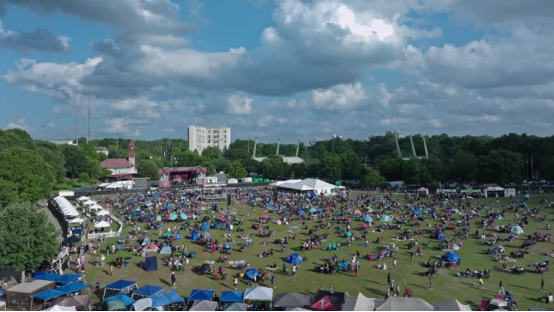 This sprawling music festival crowd uses Honeypuff rolling paper cones to set the stylish vibe.